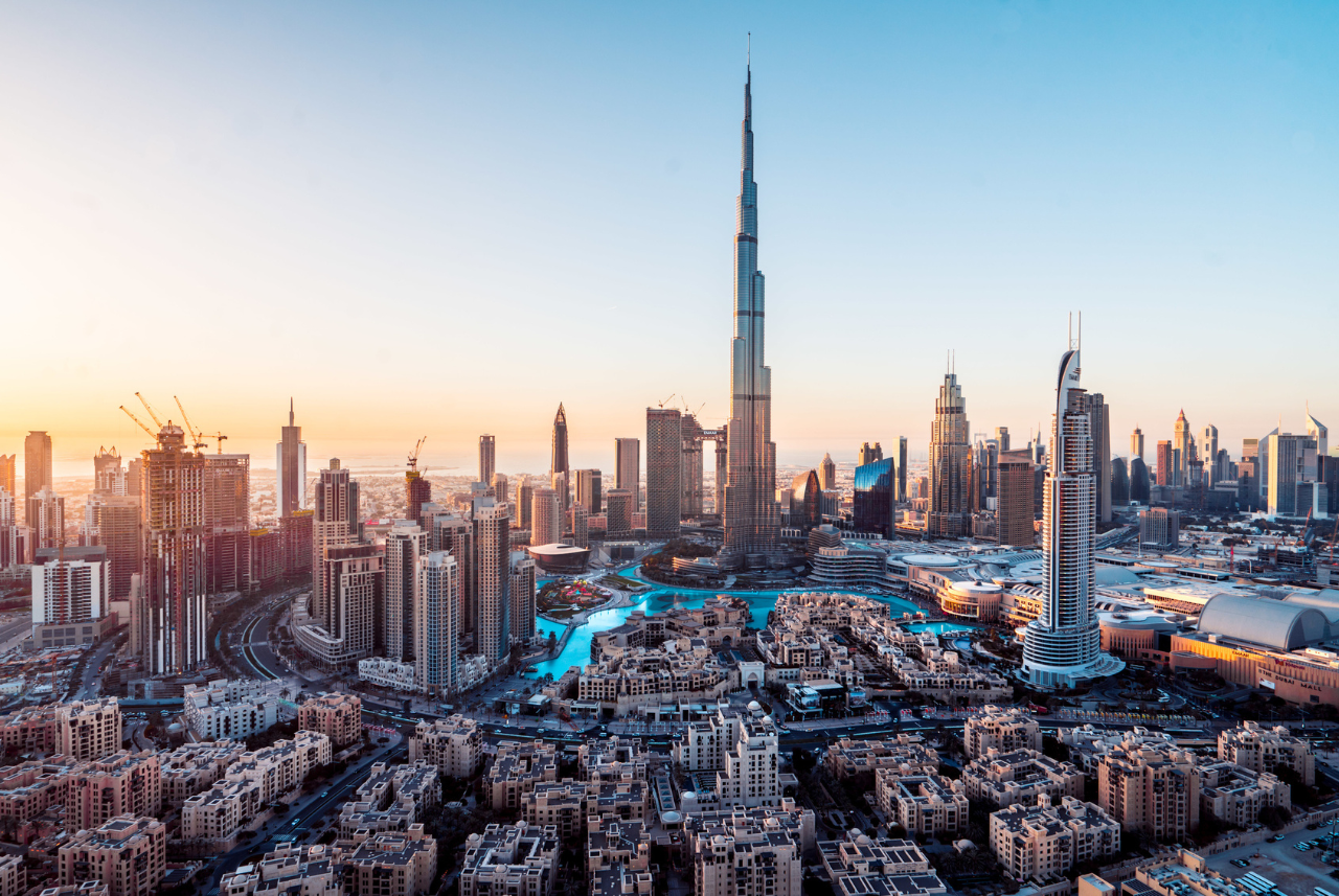 aerial view of city buildings in Dubai at sunset